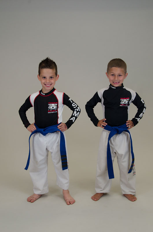 Two boys in karate equipment in Tiger Schulmann's