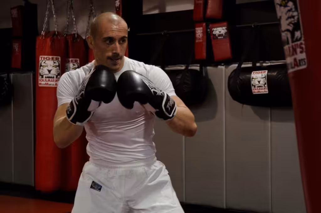 Martial arts fighter preparing to punch a bag