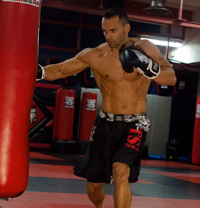 MMA fighter punching a bag in Tiger Schulmann's