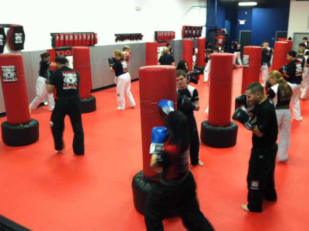Kickboxing workout with red punching bags