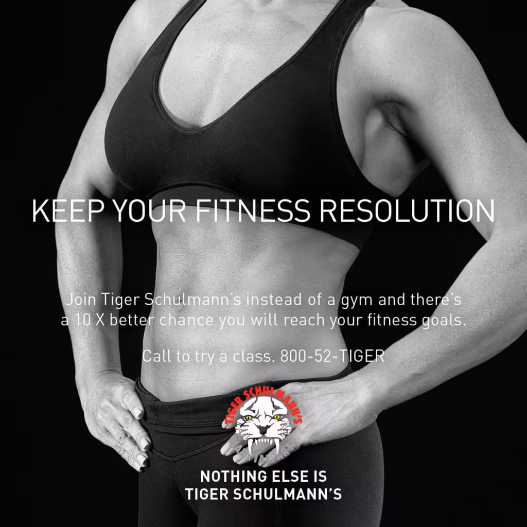 A woman posing in training outfit with white letters advertisement
