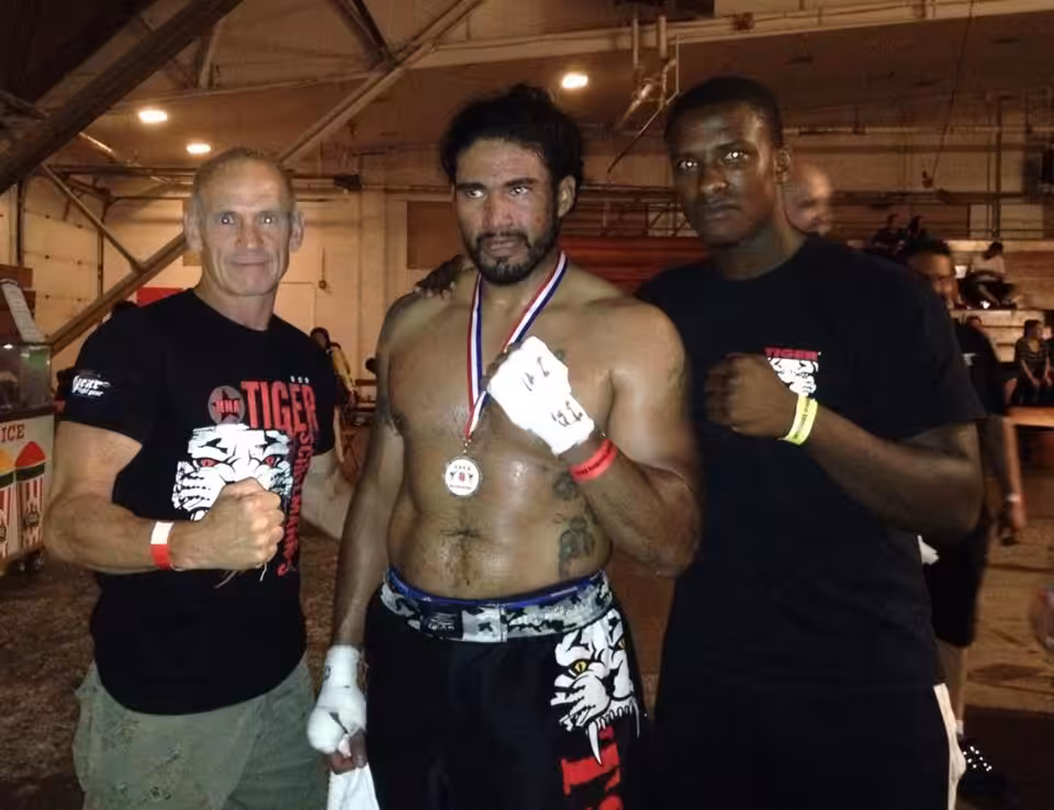 Tiger Schulmann's Martial Arts fighter Wearing Medalwith his crew members