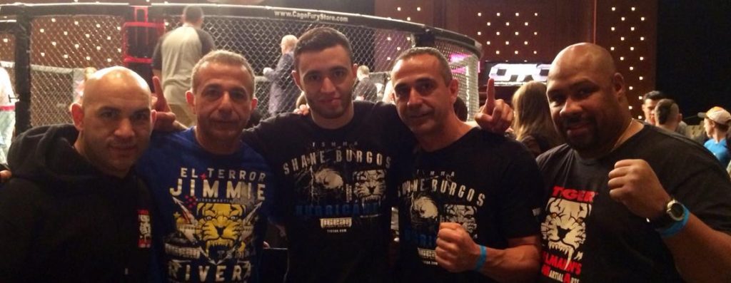 Five Tiger Schulmann's fighters with Printed Shirts outside the Octagon Ring