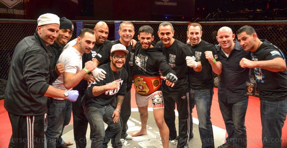 Tiger Schulmann's Martial Artsfighter with the championship belt and his crew