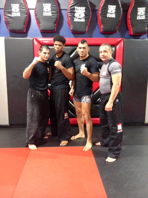 Four adult martial arts senseis at Tiger Schulmann's gym