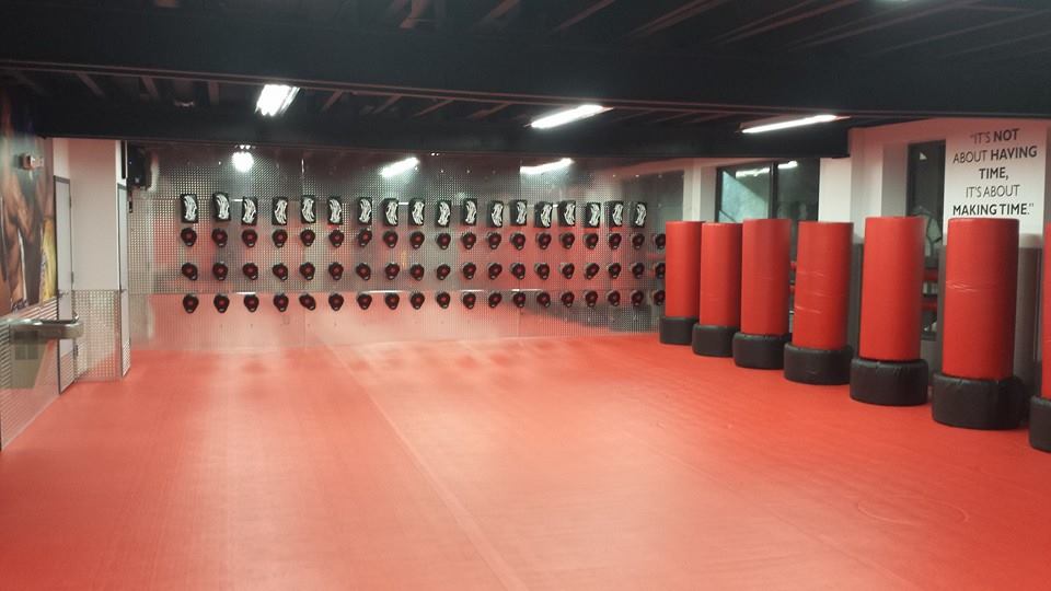 Tiger Schulmann's Martial Arts studio with red floor and punching bags