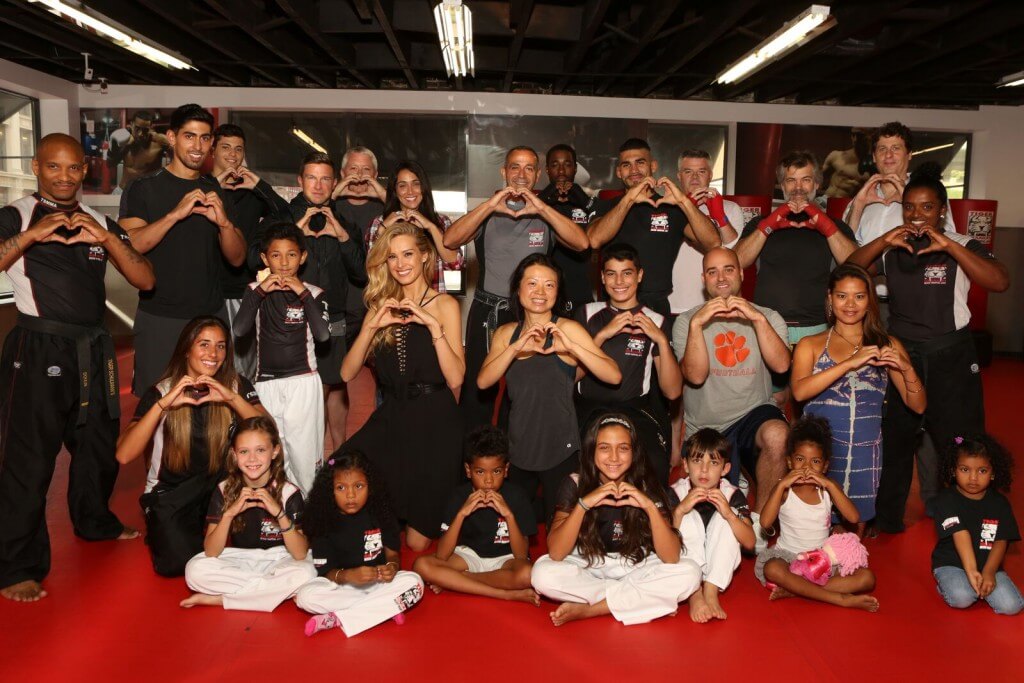 Heart Sign Group men and women posing at Tiger Schulmann's Martial Arts gym