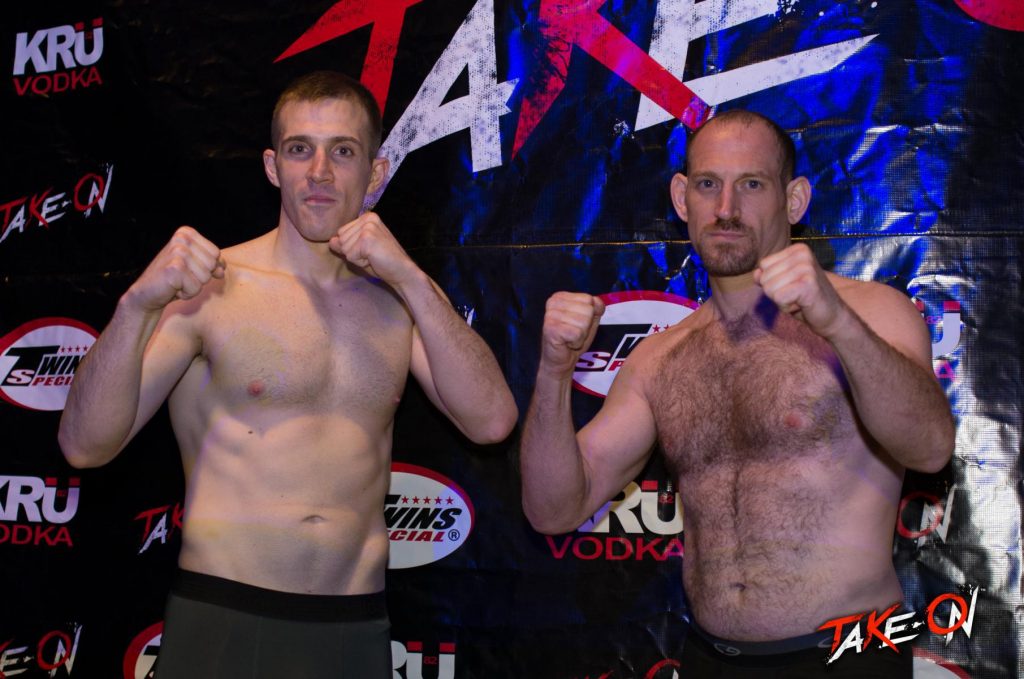 Two MMA opponents shirtless with their fists up