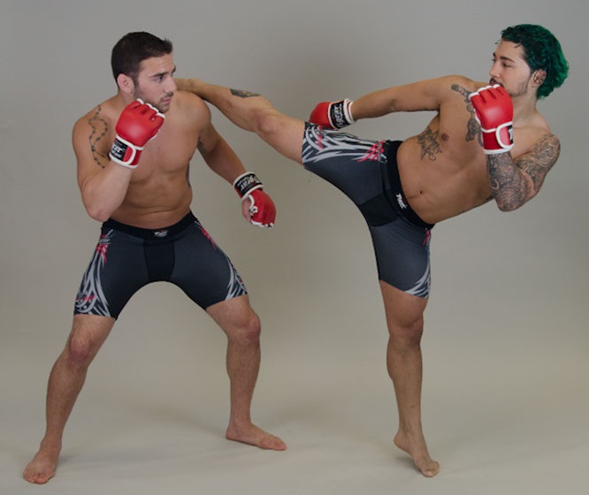 Two MMA fighters in action with gray background