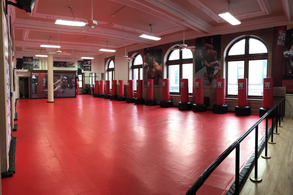 Tiger Schulmann's Martial Arts gym in Hoboken with red floors and red punching bags
