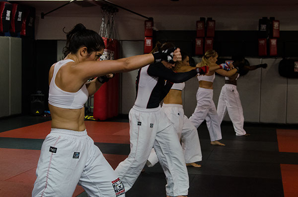 Five Women Training punching at Tiger Schulmann's gym