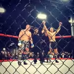 Referee in octagon declaring victory for Tiger Schulmann's Martial Arts fighter