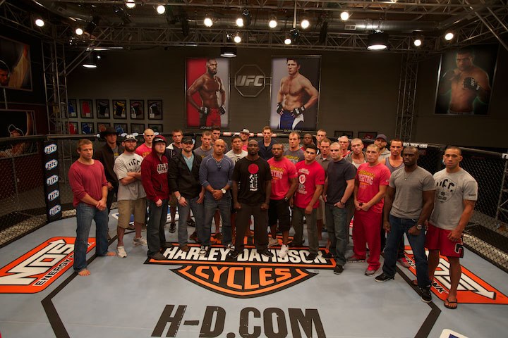 A group of adult male MMA fighters standing at Tiger Schulmann' gym