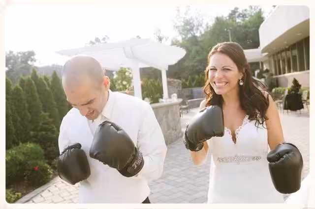 Wedding Couple with Black Tiger Schulmann's Gloves outdoors