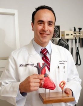 Doctor with a heart model smiling