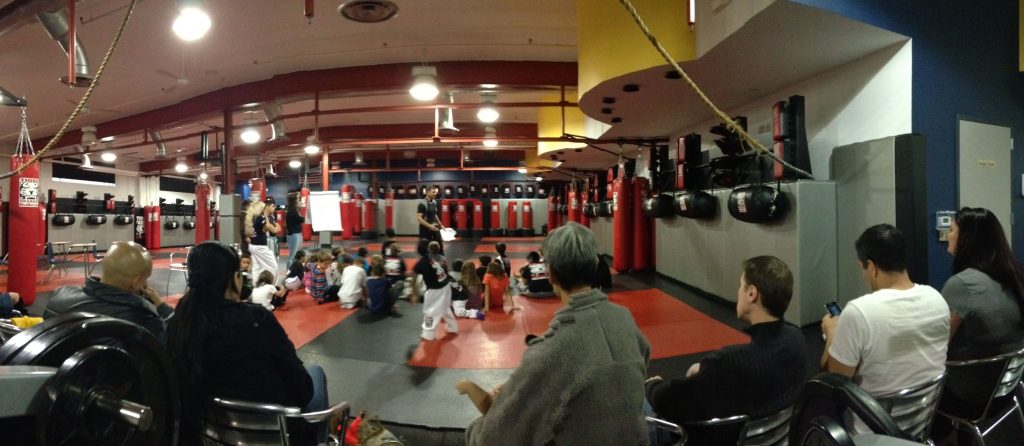 Parents sitting and watching kids training at Tiger Schulmann's gym