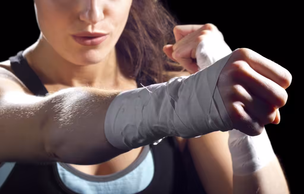 A Woman in sports outfit Punching
