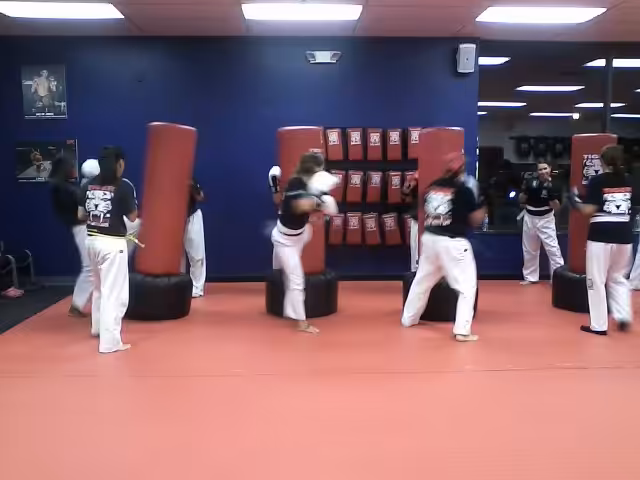 Women fighters Kicking Bags at Tiger Schulmann's East Brunswick