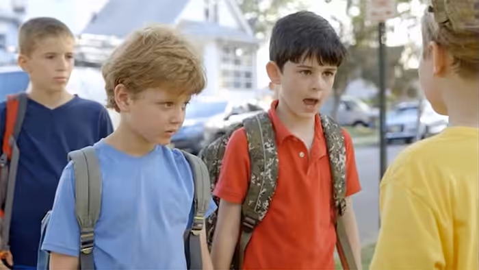 Three Boys in the Street on the way to school