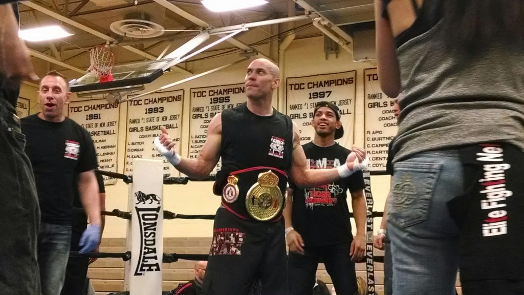Tiger Schulmann's fighter with Championship Belt and his crew