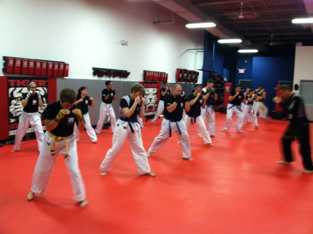 Kickboxing class for adults at Tiger Schulmann's with instructor leading the training