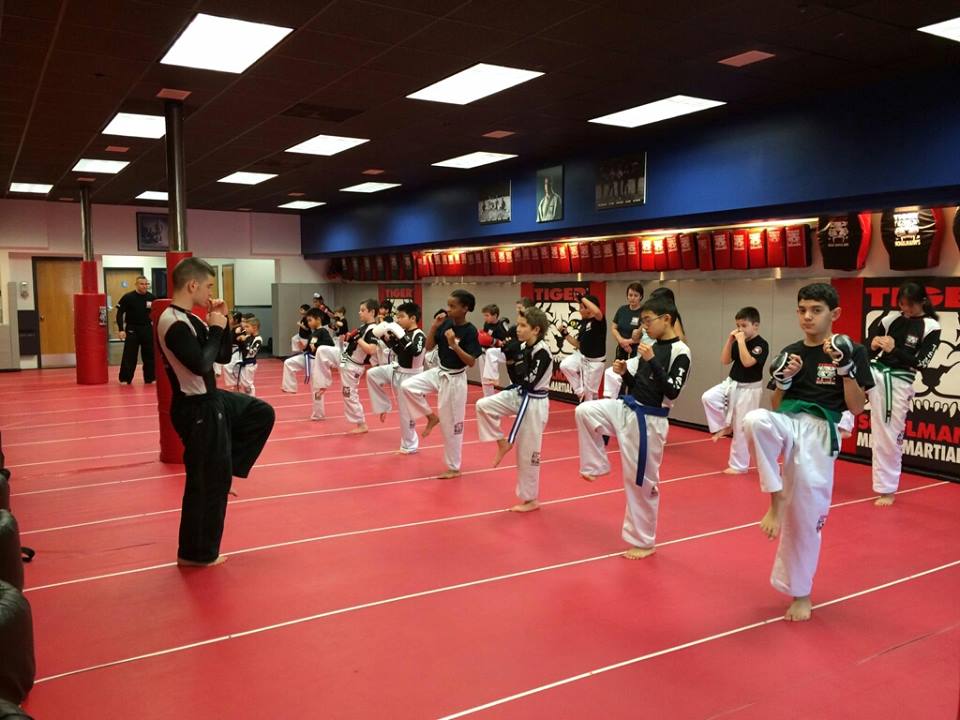 Children at karate Training with instructor at Tiger Schulmann's Syosset