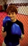 Little boy with blue boxing gloves