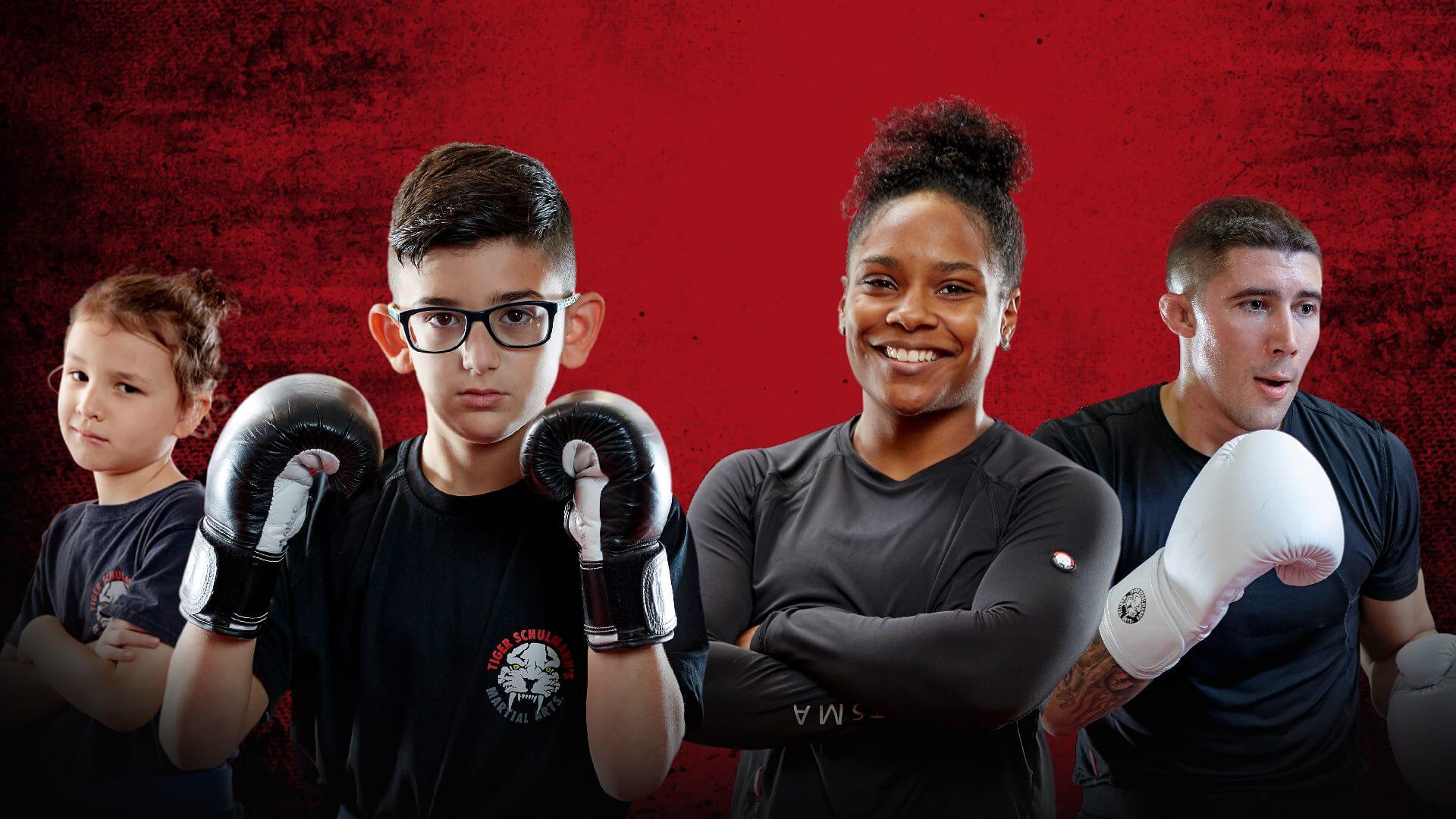 Two adult and two kids fighters posing in Tiger Schulmann's ad