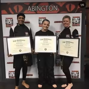 Three ladies showing their Level one instructor certificates