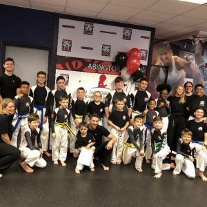 Kids and their instructors at Tiger Schulmann's in Abington
