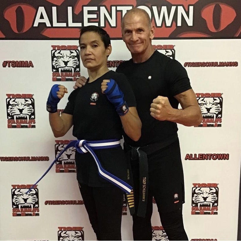 Shihan James Simpson and a woman fighter with fists up