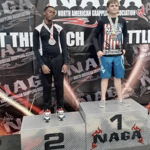 A winner and a runner up in a grappling tournament