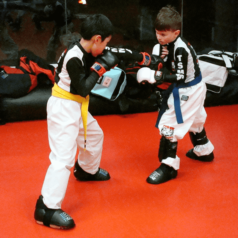 Two boys sparring at workout at Tiger Schulmann's Bayside