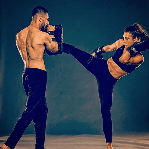 A woman and a man sparring at Tiger Schulmann's Chelsea