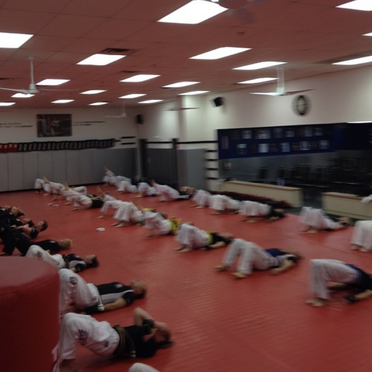 Fighters stretching at Tiger Schulmann's in Colmar