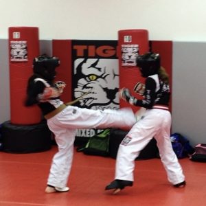 Two girls sparring at Tiger Schulmann's in Colmar