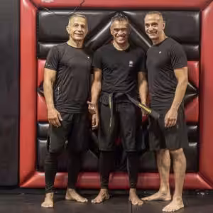 Three senseis posing at Tiger Schulmann's Garden City