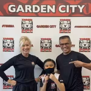 A man, a woman and a little girl at Tiger Shulmann's Garden City