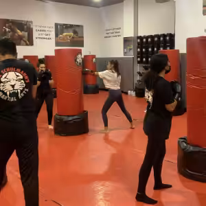 Three women and a man working out at Tiger Schulmann's Glendale