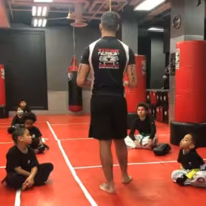 Kids martial arts training with instructor at Tiger Sculmann's Greenpoint