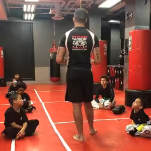 Kids martial arts training with instructor at Tiger Sculmann's Greenpoint