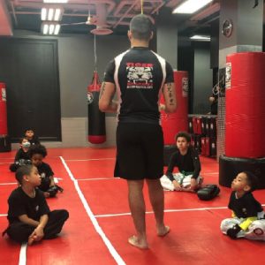 Kids martial arts training with instructor at Tiger Sculmann's Greenpoint