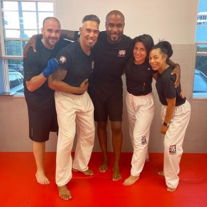 Sensei George Heurtelou and two male and two female fighters at Tiger Schulmann's