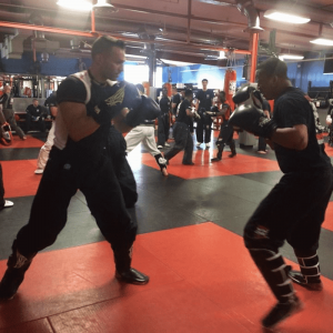 Two martial arts fighters sparring at Tiger Schulmann's Middle Village