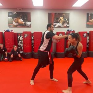 Male and female fighters sparring at Tiger Schulmann's Nanuet