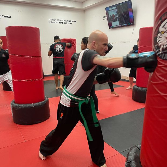 Martial arts fighter punchinga a bag at Tiger Schulmann's Nanuet
