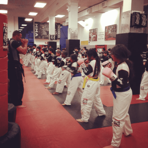 Kids workout with instructor at Tiger Schulmann's Rego Park