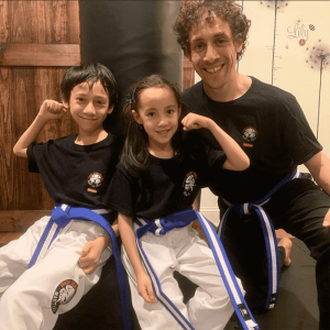 A boy and a girl with martial arts instructor in Rego Park