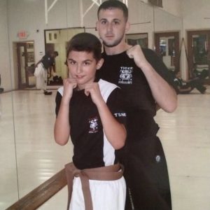 A boy and his martial arts instructor in Stamford