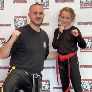 Little girl with her instructor at Tiger Schulmann's Stamford